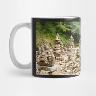 Pebbles arranged in stacks Mug